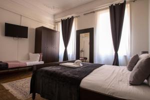 Postel nebo postele na pokoji v ubytování Granello Suite Central