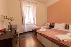 Postel nebo postele na pokoji v ubytování Granello Suite Central