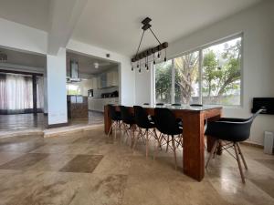 a dining room with a table and chairs at Sunset Surf Villa Beacon Hill in Simpson Bay