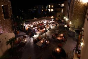an overhead view of a restaurant at night at The Westin Resort, Costa Navarino in Romanu