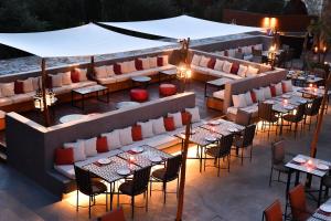 an overhead view of a restaurant with tables and chairs at The Westin Resort, Costa Navarino in Romanu