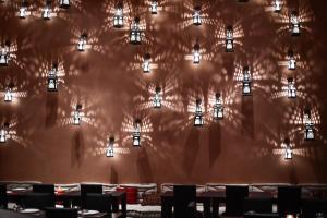 a wall with a bunch of lights on it at The Westin Resort, Costa Navarino in Romanu