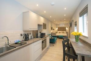 a kitchen with a sink and a counter top at Townhouse No.1 in Aberystwyth