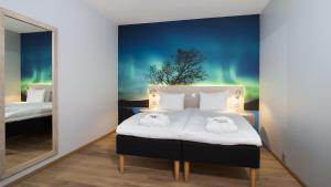 Postel nebo postele na pokoji v ubytování Thon Hotel Nordlys