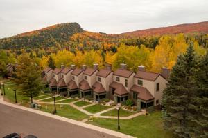 an aerial view of a house in the woods at Caribou Highlands Lodge in Lutsen