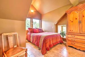 a bedroom with a bed and a wooden dresser at Romantic YosemiteandBass Lake Retreat with Mtn Views! in North Fork