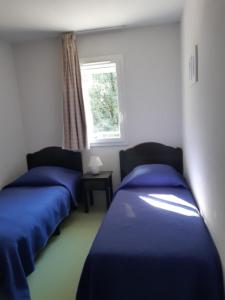 Postel nebo postele na pokoji v ubytování Maison de ville Domaine des sables