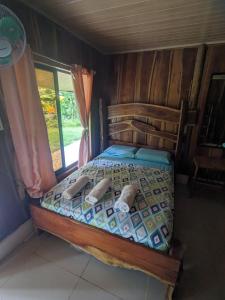 Postel nebo postele na pokoji v ubytování Corcovado Mountain House + 15 fotografií