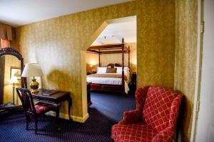 Säng eller sängar i ett rum på The Inn at Saratoga
