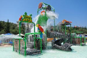 a water park with a water slide with a bird on it at Casa Dyonisia Tsilivi in Plános