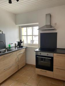 Kuchyň nebo kuchyňský kout v ubytování Gästewohnung Pohlheim Grüningen