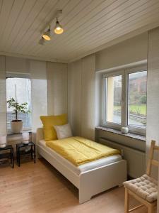 Postel nebo postele na pokoji v ubytování Gästewohnung Pohlheim Grüningen
