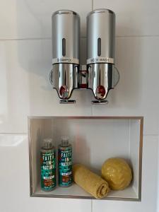 a kitchen shelf with a food processor and some food at The Nook at Hillbrow in Romsey