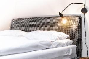 Postel nebo postele na pokoji v ubytování Adler Aparthotel