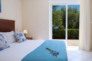 Ένα ή περισσότερα κρεβάτια σε δωμάτιο στο Villa Eione