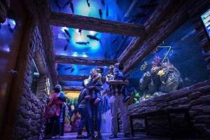 a group of people standing on a stage in a room at Wet Amusement Water Themepark Melaka Family Suite By YGM in Malacca +54 photos