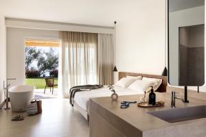 A bed or beds in a room at Armacera Resort