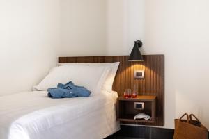 A bed or beds in a room at Armacera Resort