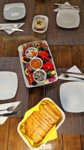 a table with a tray of food on a table at Casa Carpov Sulina in Sulina