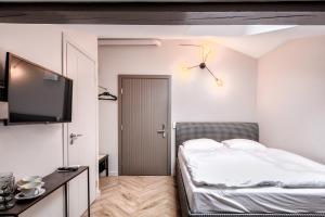 Postel nebo postele na pokoji v ubytování Adler Aparthotel
