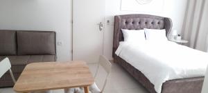 Postel nebo postele na pokoji v ubytování Regina's place