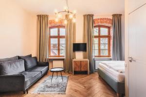 Postel nebo postele na pokoji v ubytování Adler Aparthotel