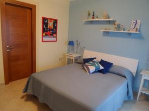 Postel nebo postele na pokoji v ubytování Il Giardino delle Zagare