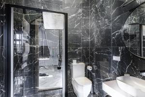 Koupelna v ubytování Adler Aparthotel