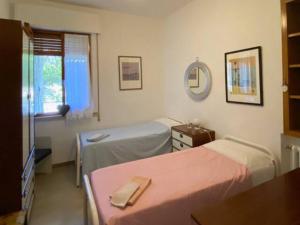 A bed or beds in a room at Via Verdi 14