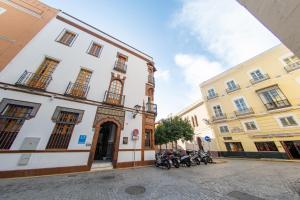 a group of motorcycles parked in front of a building at MI RETIRO SEVILLANO in Seville