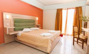 Ein Bett oder Betten in einem Zimmer der Unterkunft Zante Plaza Hotel & Apartments