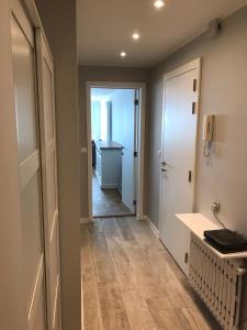a hallway with a hallway leading to a room at Knokke Sea, Appartement Vue mer in Knokke-Heist