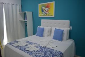 Ένα ή περισσότερα κρεβάτια σε δωμάτιο στο Pousada Vovó Zilda Maragogi