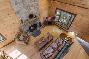 an overhead view of a living room with a stone fireplace at 1 Kingfisher in Blowing Rock