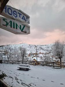 a sign for aossana sauna in the snow at Hostal Sainz in Riaño