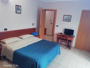 Tempat tidur dalam kamar di Villa Biancofiore