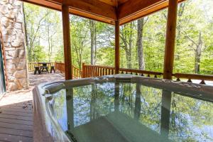 a swimming pool on the porch of a house at A Beary Good Time in Boone