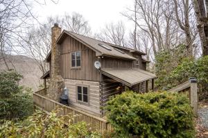a tiny house on the side of a hill at A Rustic Hideaway in Todd