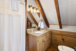 a bathroom with a sink and a toilet at Almost Heaven in Boone +39 photos