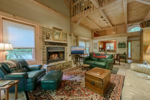 a living room with a couch and a fireplace at Barwaller in Boone