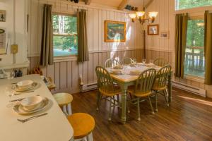 a dining room with a table and chairs at Benzine Farm in Beech Mountain