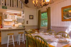 a dining room with a table and chairs at Benzine Farm in Beech Mountain