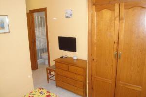 TV a/nebo společenská místnost v ubytování Hostal Cristina