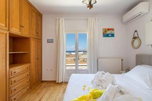 A bed or beds in a room at SAIL VILLA