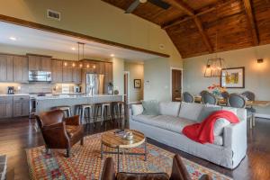 a living room with a couch and a kitchen at Blue Ridge Mtn Club Condo C-303 in Boone
