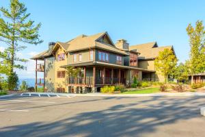 a large house with a road in front of it at Blue Ridge Mtn Club Condo C-303 in Boone