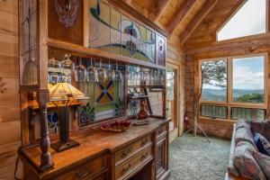 a room with a wooden wall with stained glass windows at Blue Ridge View in Blowing Rock