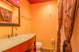 a bathroom with a sink and a toilet at Chalet Blueberry in Blowing Rock +25 photos