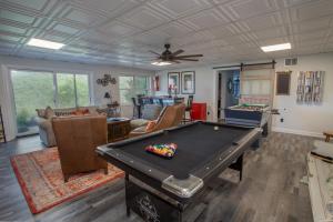 a living room with a pool table in it at Eagles Nest on Seven Devils in Seven Devils