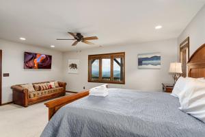 a bedroom with a bed and a couch at Elevated Escape in Blowing Rock
